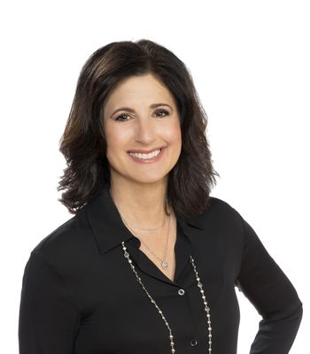 Portrait of Dina Sierra Smith, REALTOR®.
